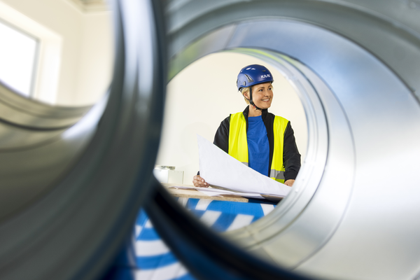 Construction site photo shoot session Experience Center EC High resolution Woman drawing duct Annica Pettersson